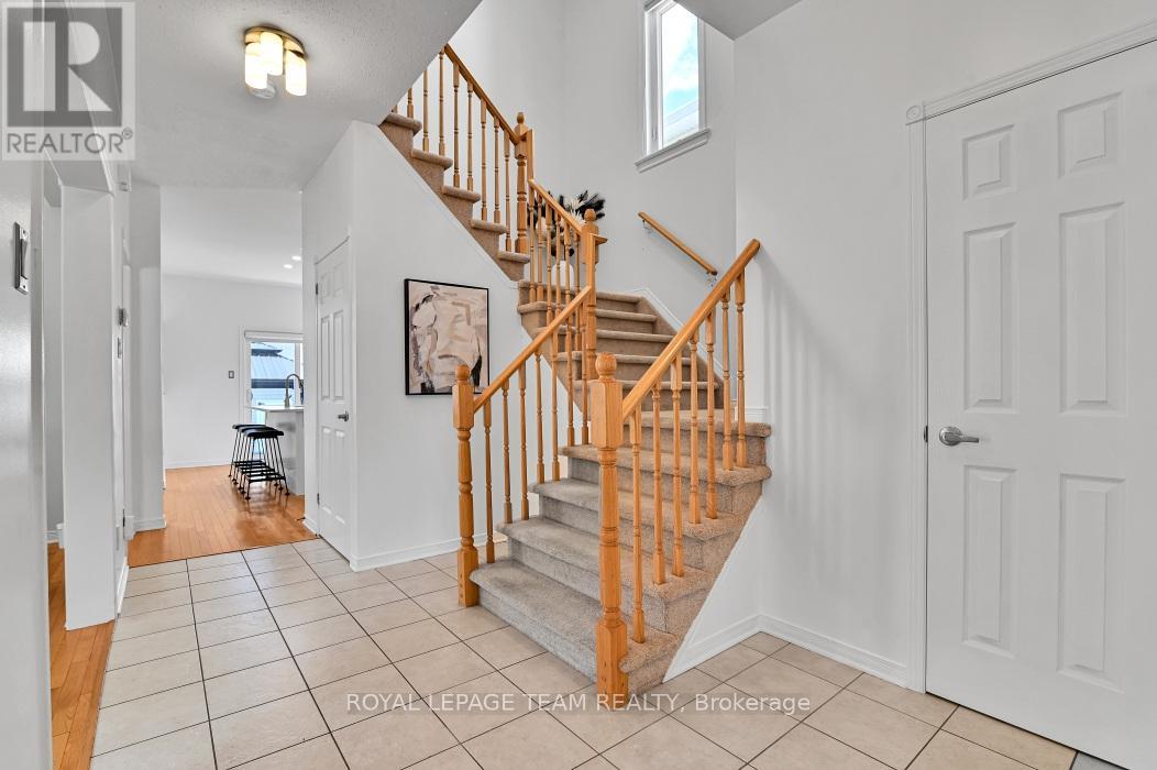 Foyer has access to garage & powder room