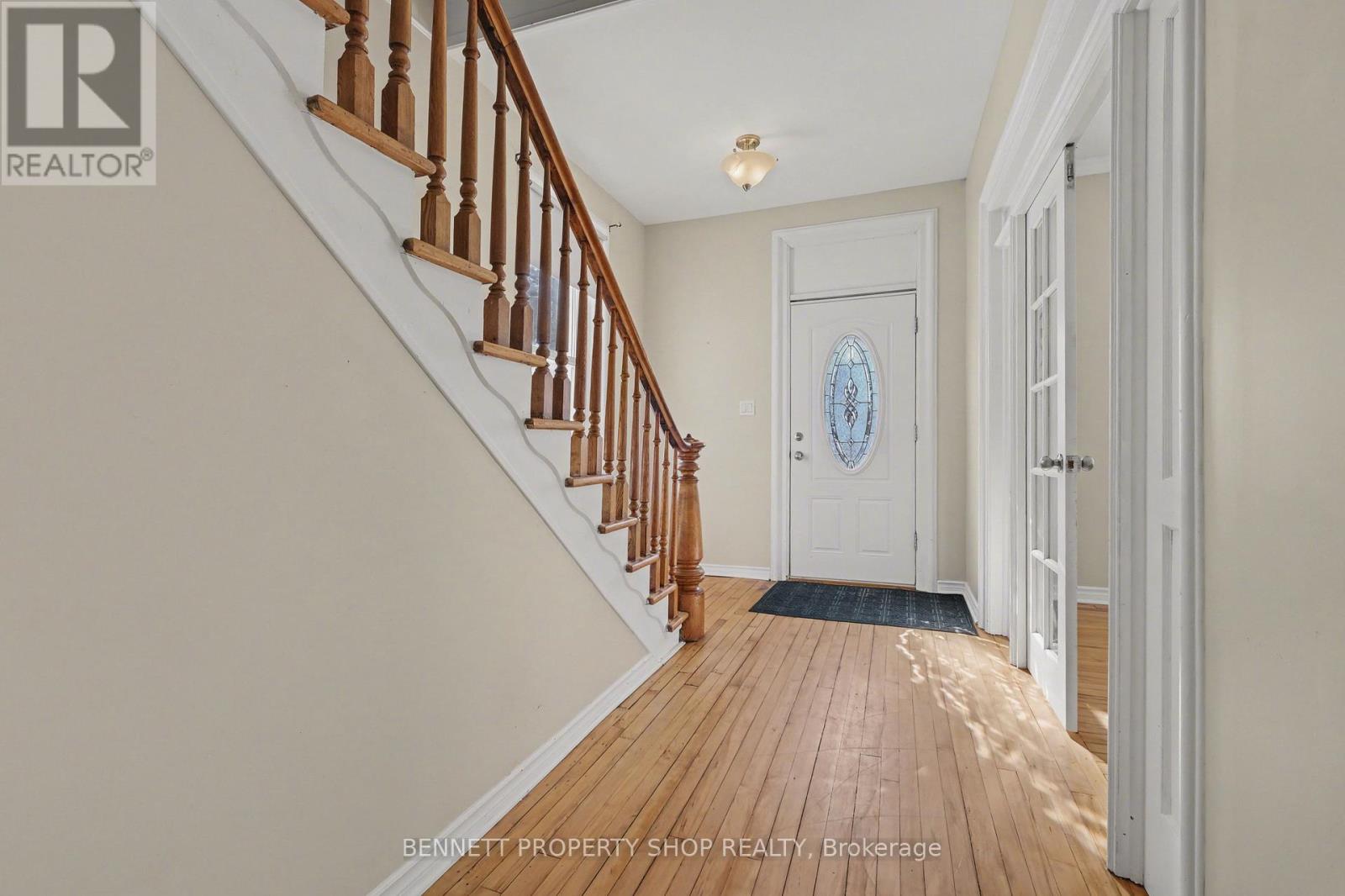Front entrance foyer, original banister