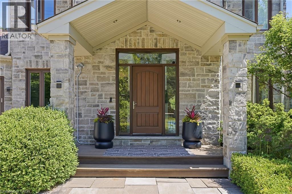 Stone veneer facade with a covered entry