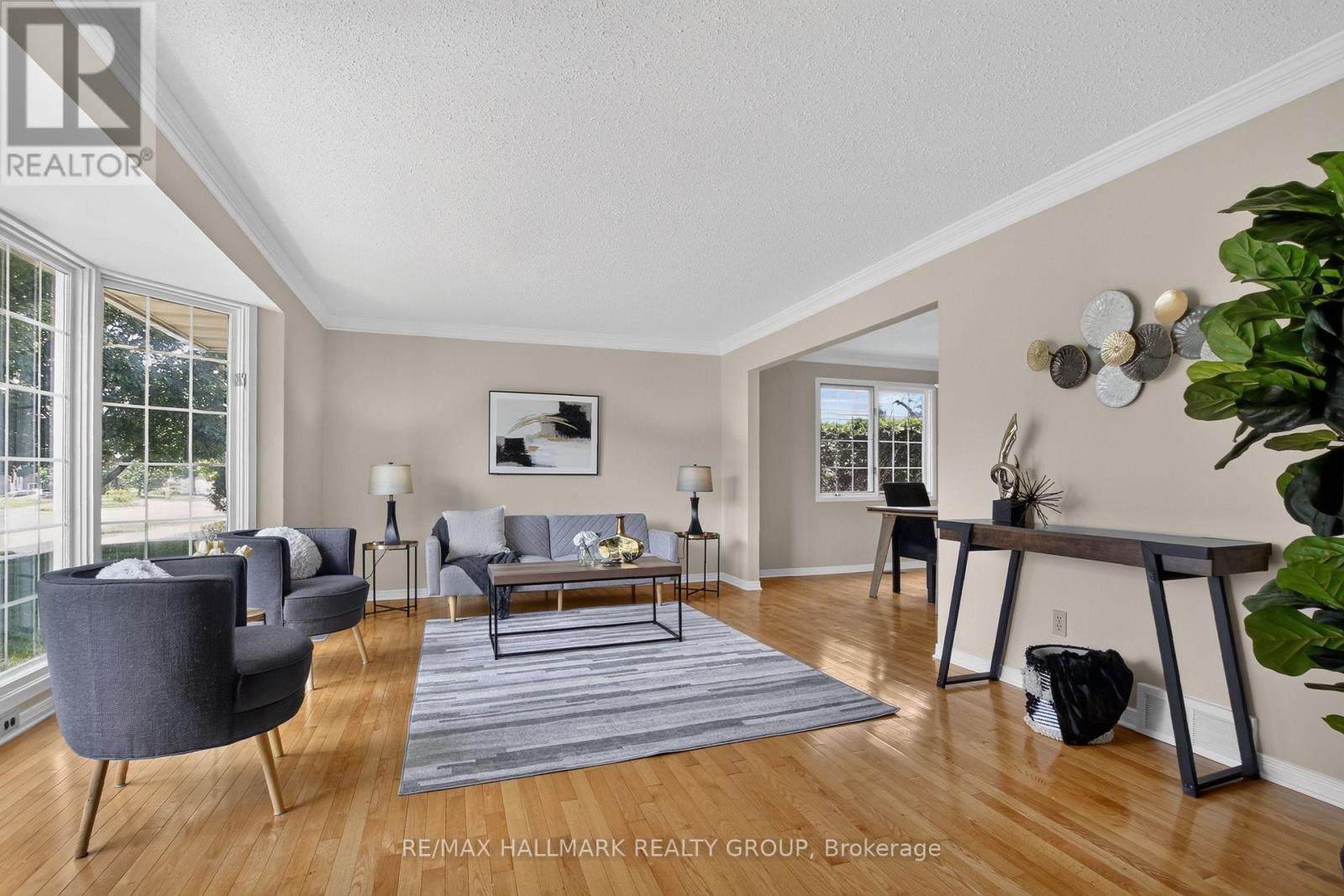 Large front living room with beautiful hardwoods.