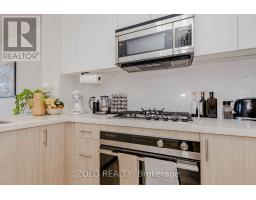 208 - 123 Maurice Drive, Oakville, ON L6K2W6 Photo 11