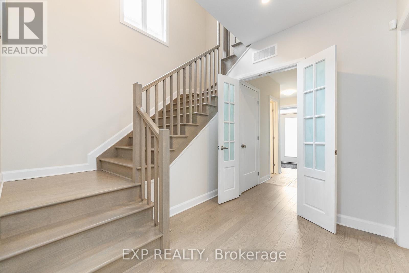 Extra Wide Stairs & Open to Below w/French Doors