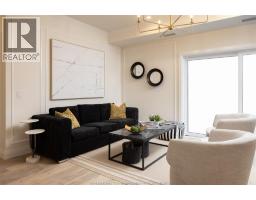 Living room/Fireplace - 1740 Sprucewood Avenue Unit# 207, Lasalle, ON N9J1X7 Photo 6