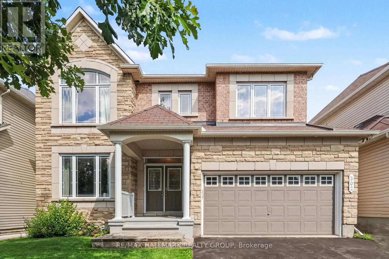 Stone front, covered porch & double door entry
