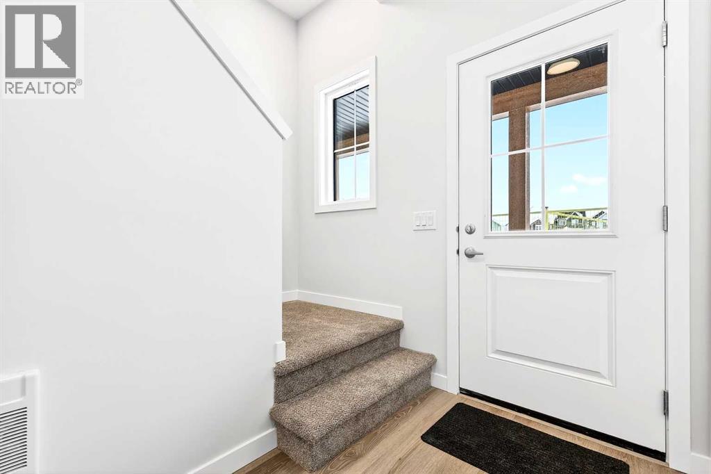 302, 40 Creekside Way SW, Pine Creek, Calgary photo 2