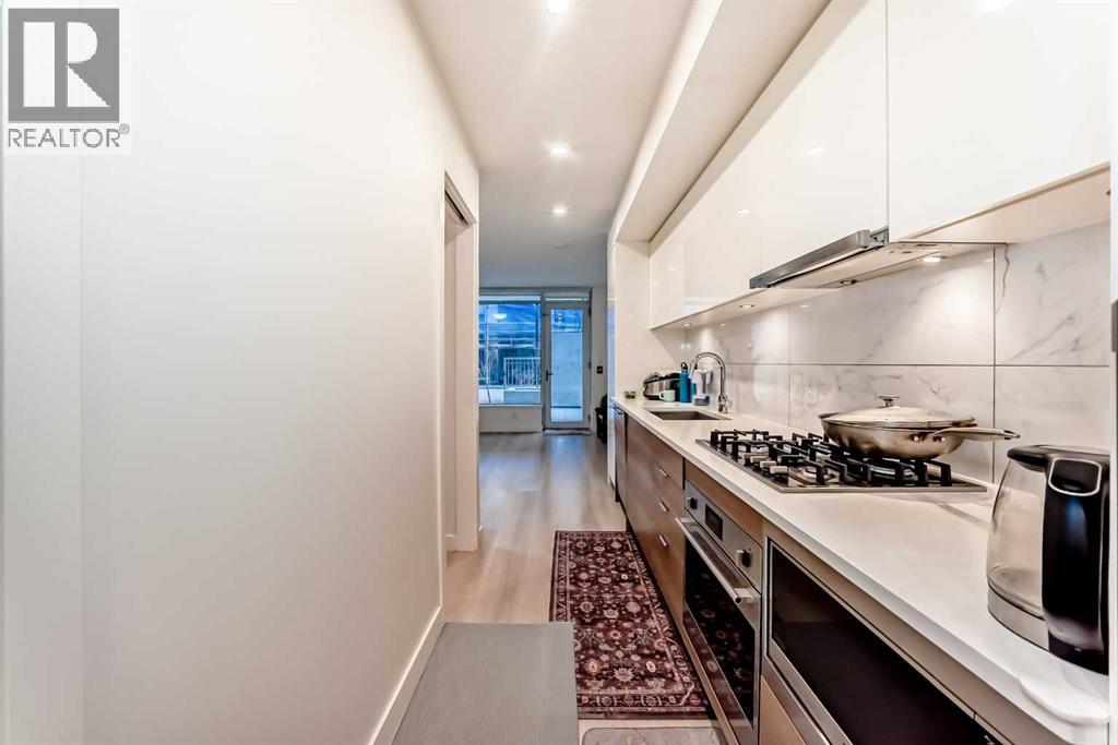 #104 108 Waterfront Court SW - 24
