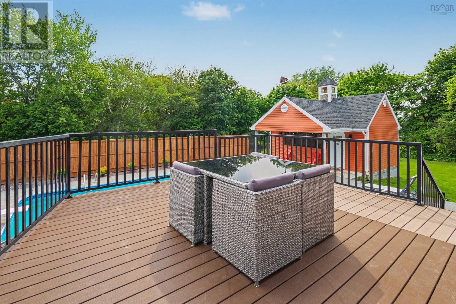 Back deck over looking in ground pool