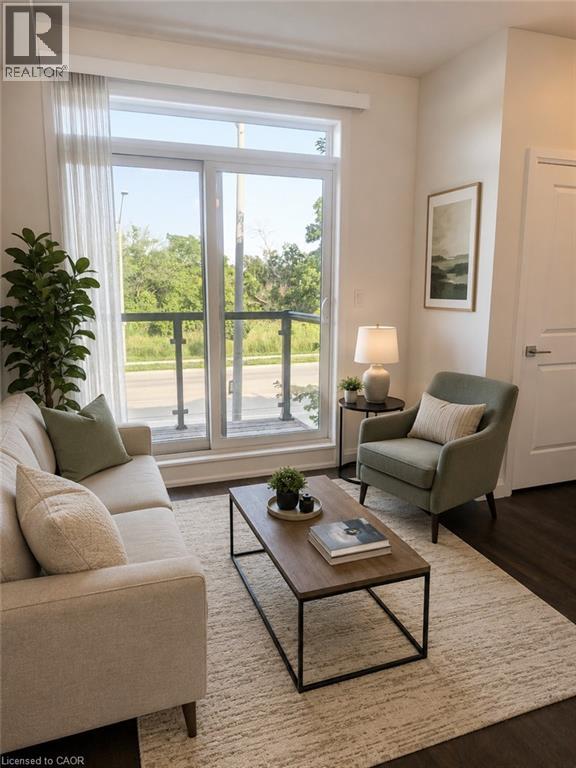 Living space featuring dark wood-finish flooring, a light-toned area rug, and white walls