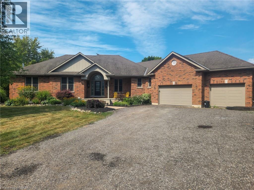 Ranch Style Bungalow with extra wide double car garage and a fantastic front porch for sipping coffee in the morning with the sunrise