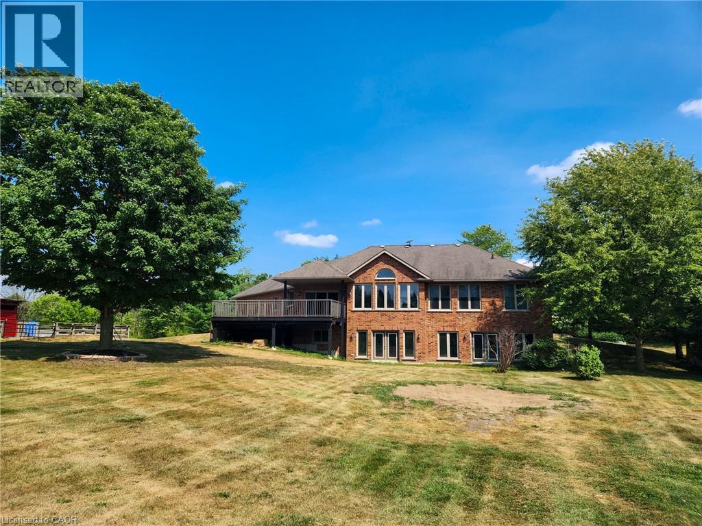 Back of the home with double walk out basement, and lots of natural light for scenic views
