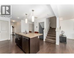 Family room - 562 River Heights Crescent, Cochrane, AB T4C0T8 Photo 7