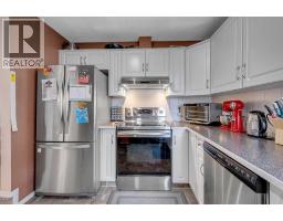 Bedroom - 13, 200 Hidden Hills Terrace Nw, Calgary, AB T3A6E8 Photo 11