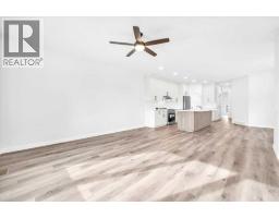 Living room - 1014 Limit Avenue, Crossfield, AB T0M0S0 Photo 7