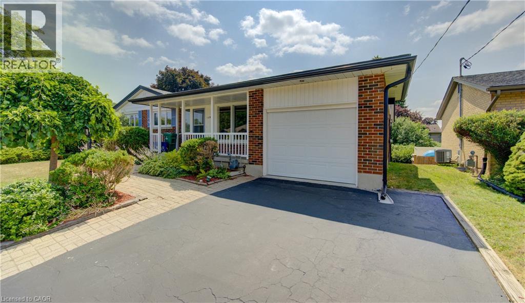 Brick exterior with white siding accents and a single-car garage