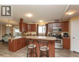 Living room - 65, 15 Mackenzie Ranch Way, Lacombe, AB T4L0B4 Photo 9
