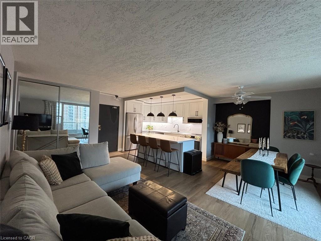 Open-concept living area featuring wood-finish flooring throughout