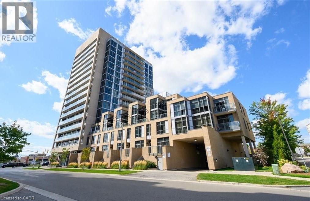 Modern high-rise building featuring extensive glass curtain walls, individual balconies with glass railings, and a multi-level lower facade with integrated windows
