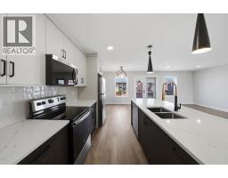 Family room - 20 Toye Street, Red Deer, AB T4P0Y5 Photo 14