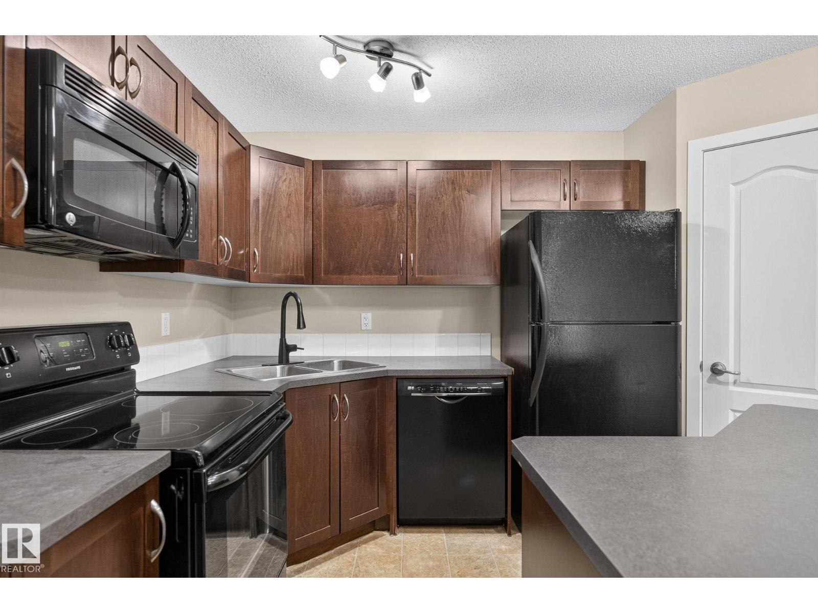 #210 392 SILVER BERRY RD NW - 12