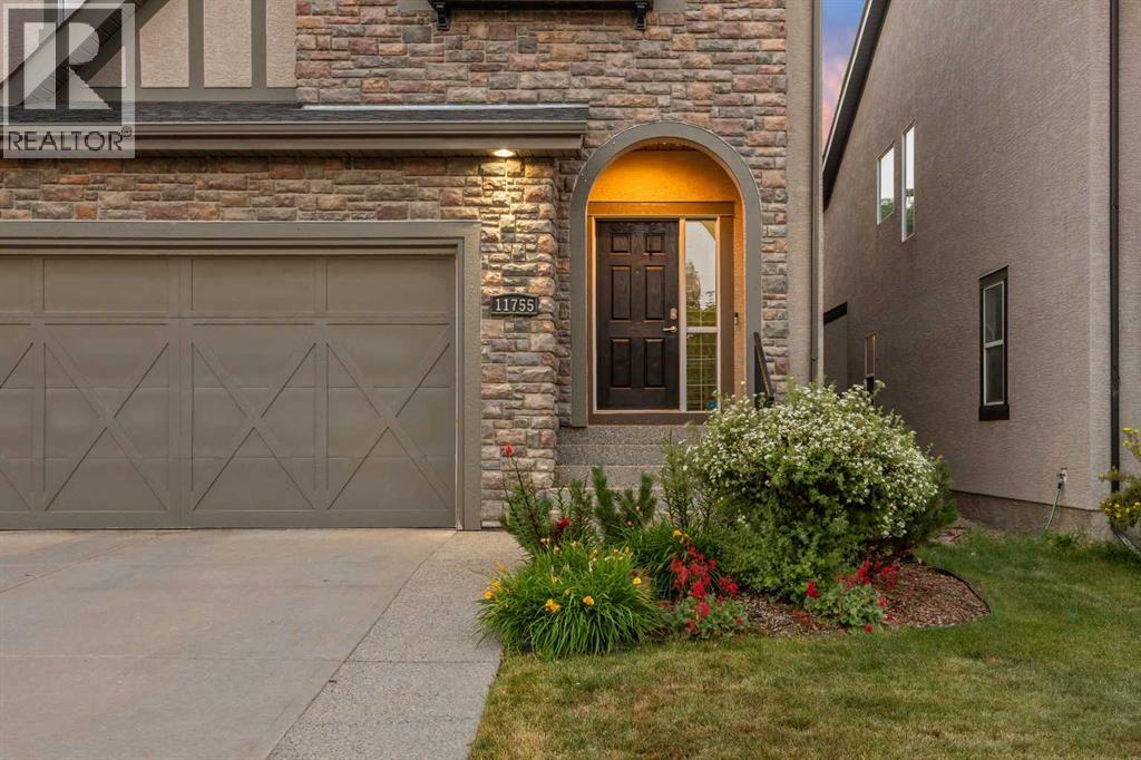 Stone accents and warm exterior lighting welcome you home, with pride of ownership on full display from the moment you pull into the driveway