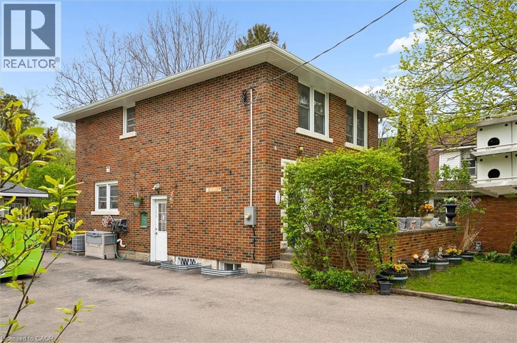 Brick exterior with multiple windows and white trim