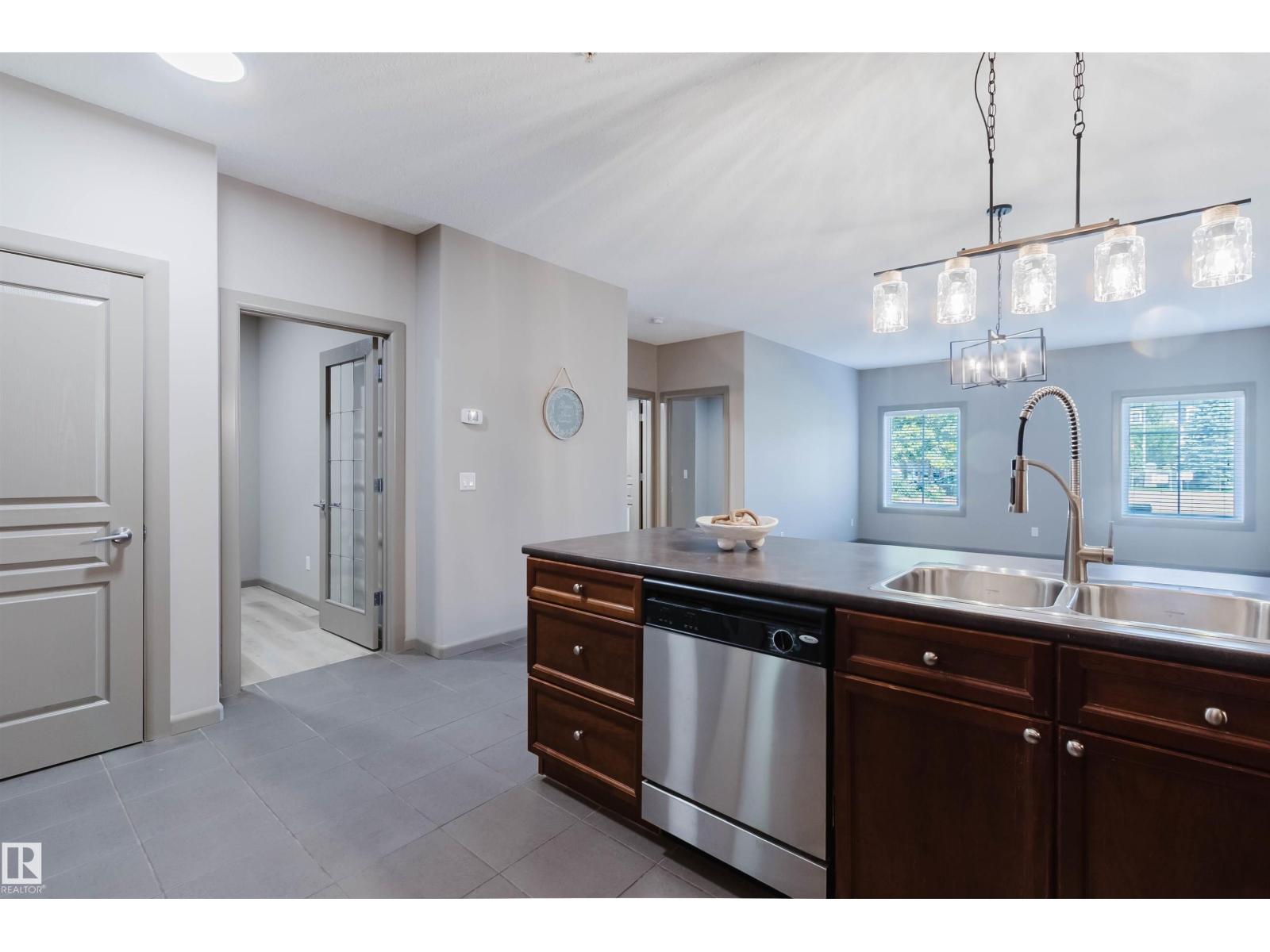 #106 160 MAGRATH RD NW - 18