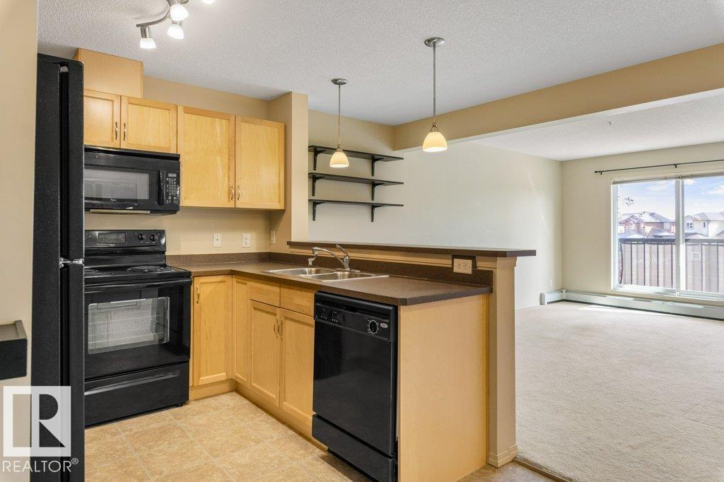 #203 5951 165 AV NW - 9