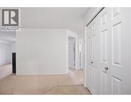 Living room - 3211, 16969 24 Street Sw, Calgary, AB T2Y0L2 Photo 9