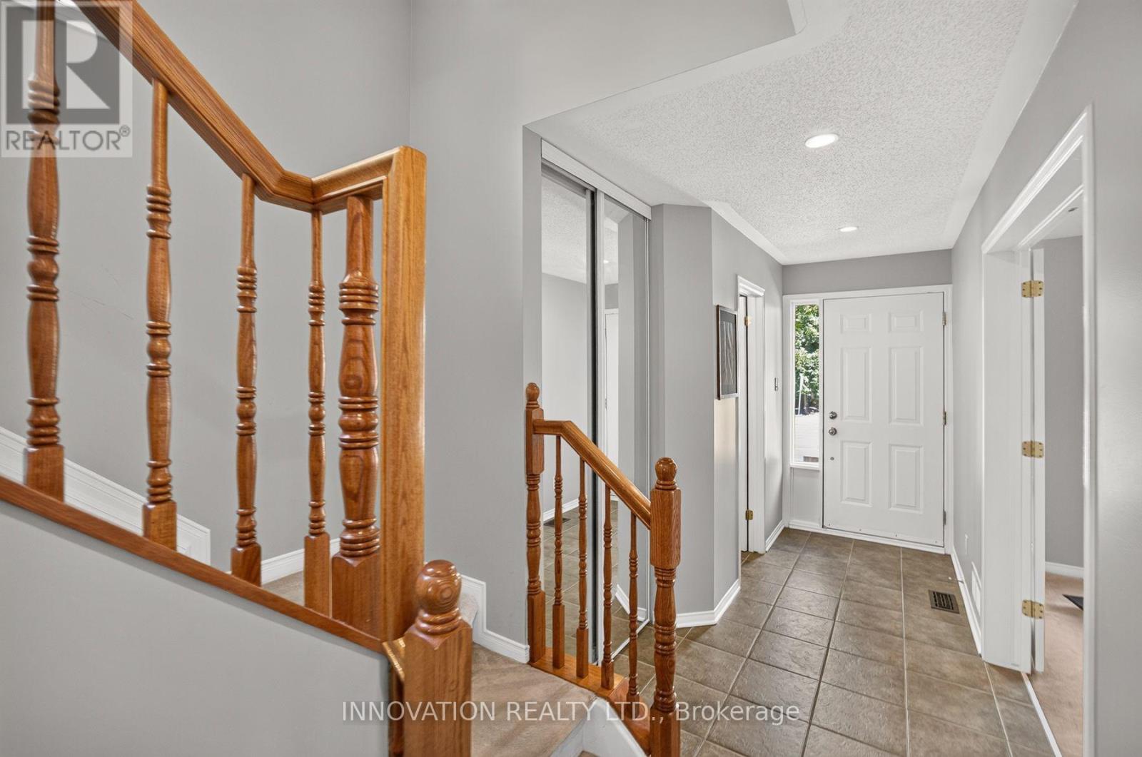 Formal foyer w tile floor & coat closet