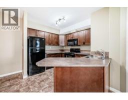 Kitchen - 206, 69 Ironstone Drive, Red Deer, AB T4R0J8 Photo 9