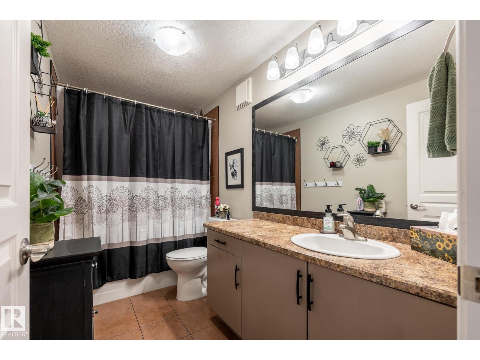 #305 9940 SHERRIDON DR - 23