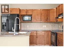 Laundry room - 391 Cimarron Boulevard, Okotoks, AB T1S0A9 Photo 9