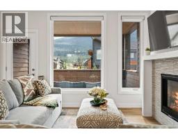 Living room - 202g, 209 Stewart Creek Rise, Canmore, AB T1W0N9 Photo 6