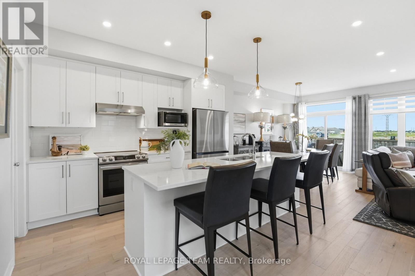 Pendant lights and quartz counters with overhang