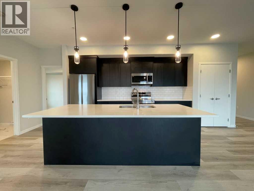 #2304 42 Cranbrook Gardens SE - 1