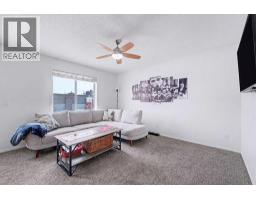 Family room - 102, 800 Yankee Valley Boulevard Se, Airdrie, AB T4A2L1 Photo 9
