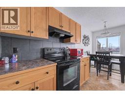 Bedroom - 102, 800 Yankee Valley Boulevard Se, Airdrie, AB T4A2L1 Photo 7