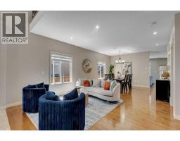 Family room - 308 Kinniburgh Link, Chestermere, AB T1X0P8 Photo 7