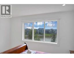 Living room - 1125 Channelside Drive Sw, Airdrie, AB T4B3J4 Photo 19