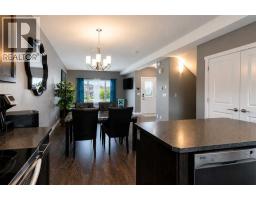 Family room - 18 Hanson Green, Penhold, AB T0M1R0 Photo 10