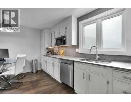 Family room - 36 Coach Manor Rise Sw, Calgary, AB T3H1C4 Photo 13
