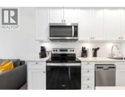 Primary Bedroom - 405, 123 4 Street Ne, Calgary, AB T2E8K3 Photo 7