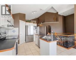 Primary Bedroom - 215 Rocky Ridge Drive Nw, Calgary, AB T3G4M1 Photo 8