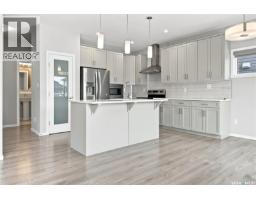 Family room - 450 Aniskotaw Way, Saskatoon, SK S7V1M3 Photo 7