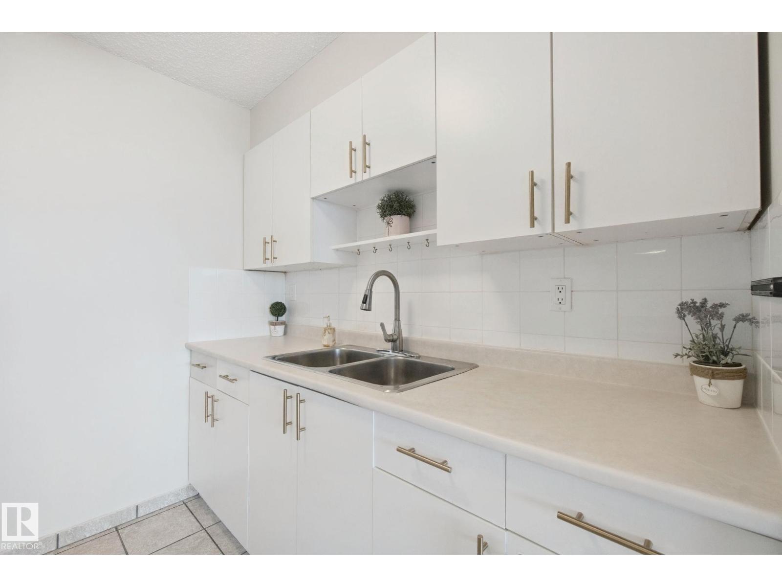 #104 8745 165 ST NW - 25