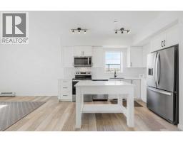 3104, 3727 Sage Hill Drive NW - photo 2