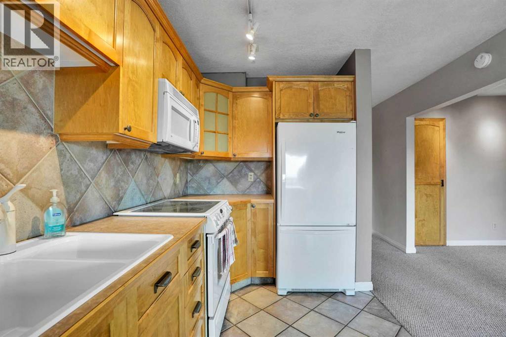 #103 520 Cedar Crescent SW - 24