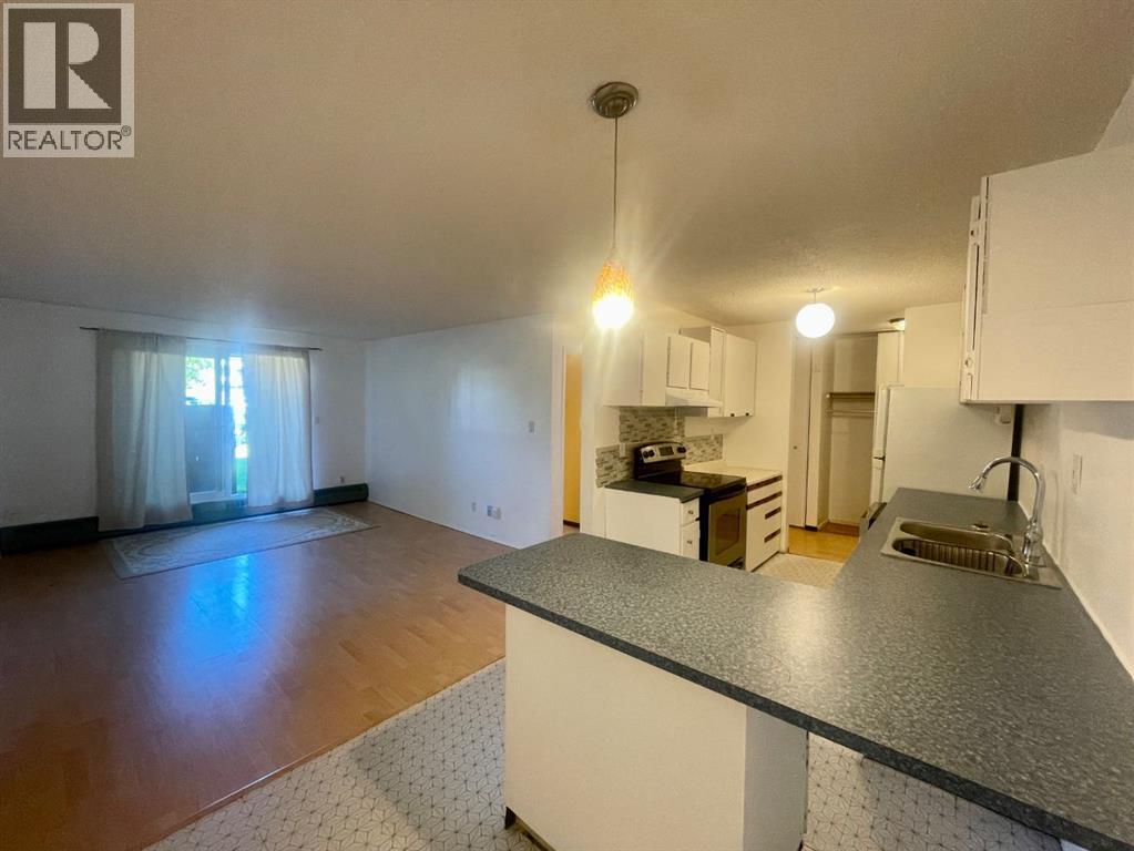 #110B, 5611 9 Avenue - 4