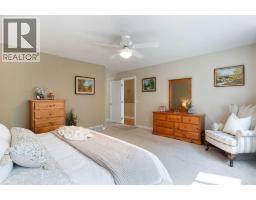 Bedroom - 128 Waterstone Place Se, Airdrie, AB T4B2G1 Photo 17