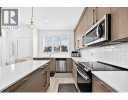 Laundry room - 118 Chelsea Mews, Chestermere, AB T1X2T1 Photo 9